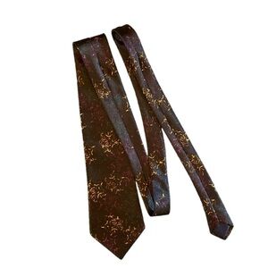 Handmade Mercedes black silk tie with a starfish type pattern  4”